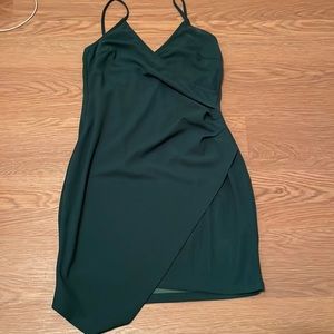 She in green mini dress